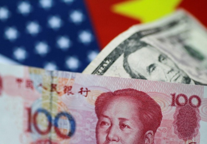 중국 위안화가 미국 달러화에 대한 '안전한 피난처' 대안이 되려면 아직 멀었다고 씨티그룹 경제분석가들은 예측했다. 사진=로이터