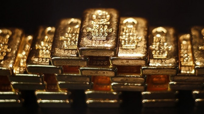 금리 인상이 빨라질 것이라는 전망에 미국 달러 가치가 상승하고 국제 금값은 하락했다. 사진=로이터
