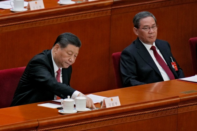 지난 11일 폐막한 양회 결과에 대한 반응이 엇갈리고 있다. 사진은 전인대 폐막식 참석한 시진핑 중국 국가주석(왼쪽)과 리창 총리. 사진=AP/연합뉴스