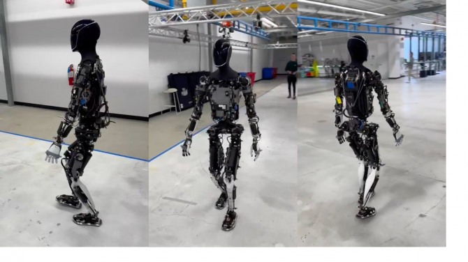 테슬라 개발 부서의 실험실에서 보행하고 있는 휴머노이드 로봇 옵티머스. 사진=테슬라