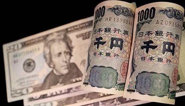 미국 20달러 지폐와 일본 1000엔 지폐가 나란히 놓여 있다.     사진=로이터/연합뉴스